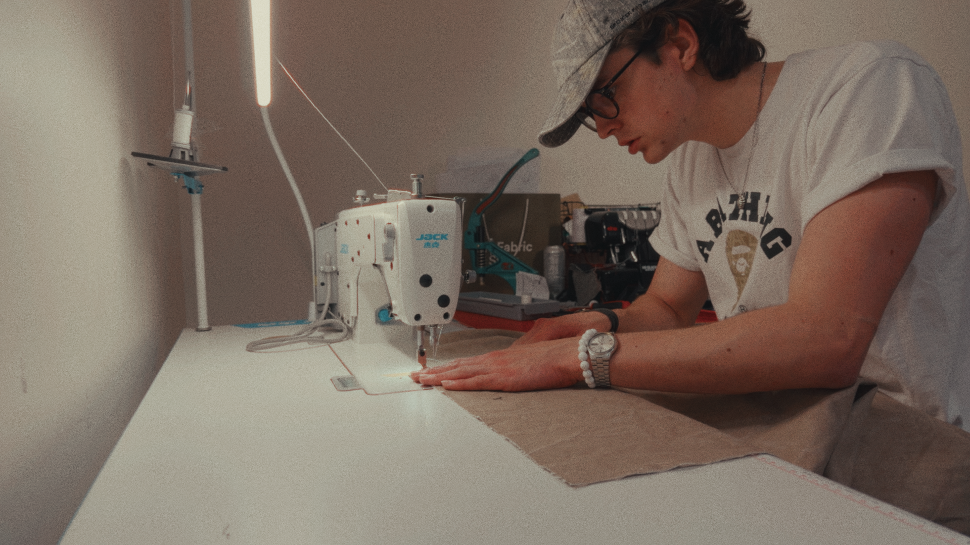 Callum Godfrey sewing bespoke denim